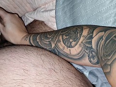 Tattooed stepmom jerks off stepsons cock, making him feel like a king