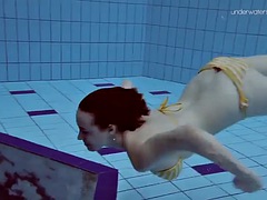 Teen Lada with small tits naked underwater