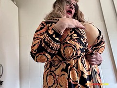 Naughty Gilf shows her huge tits in the bathroom