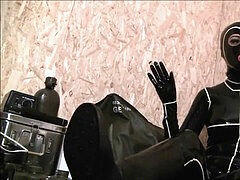 Gas Mask And spandex Catsuit In A Bunker