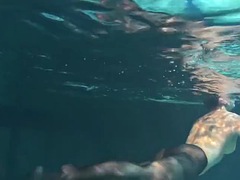 Clothed underwater beauty Bulava Lozhkova swimming naked