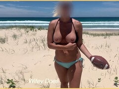Hot stepmom at the beach playing football topless showing off her boobs