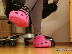 Under Desk Foot Play - Pink Clogs and Worn Socks