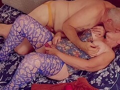 Elderly woman pleasuring herself, achieving climax, in a lustful display