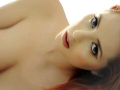 Redhead babe Lucy Vixen shows us what a big rack looks like as she takes her bra off.