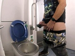 I use a massager in the restroom of a driving school to handle my thick cock and finish off