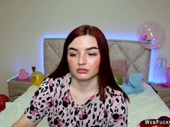 Big tits redhead strips to bra