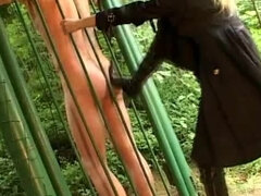 Exhibitionist femdom kicking & pussy dominate slave outdoor through the fence