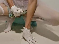 Sissy masturbating her big cock in latex gloves and a tutu dress