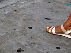 Candid ebony feet at the bus stop