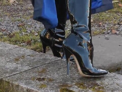 Sexy blonde lady blue leather and shiny boots