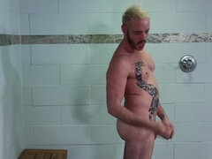 Tattooed lad takes a shower when things turn steamy