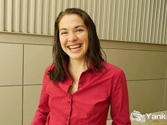 Smiling happy brunette Lilith Wilder is playing with her shaved pussy