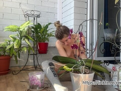 A Naked Gardener Plants Flowers and Pleases the Neighbors with Her Appearance