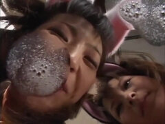 two cuties dressed as animals try to suck a guy's tongue off