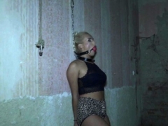 Blonde bdsm sub pinioned with ropes by domme