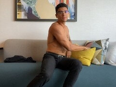 Uncut stud with glasses goes solo in a motel until he erupts in a giant fountain of cum