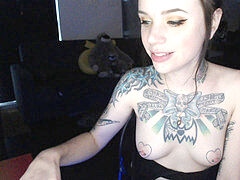 tattooed webcam damsel inhales and gags on dildo