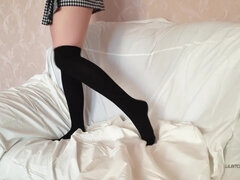 A Schoolgirl In Uniform Shows Her Long Legs