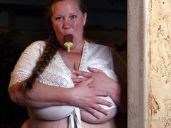 Incredible busty MILF posing topless with her monster boobs exposed