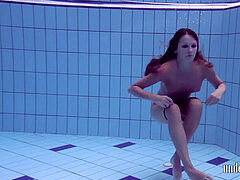 Lucy unclothes swimsuit in the pool