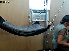 Mature gay dad with tattoos and mustache fucked in a sling