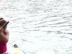 Big tit girl masturbating in a rowing boat