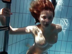 Zuzanna swims undressed and furthermore aroused in the pool