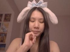 Cute Asian girl Alize Zaide in bunny costume enjoys ASMR vibes