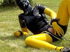 jerk with inflatable faux-cock in spandex catsuit