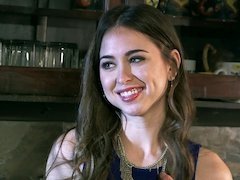 A brunette with a nice pussy is sitting down on a big cock