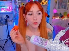 Kinky redhead girl enjoys some carrot snacks in an ASMR style