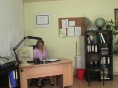 Aged woman rides fuck pole in the office