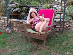 Simone slowly undresses outdoors and plays