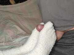 Loulou demands a footjob wearing her cozy white fuzzy socks