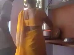 Sly hubby fucks and records Indian wife in the kitchen