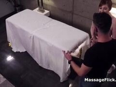 Hot MILF gives secret handjob under massage table - big boobs spy cam