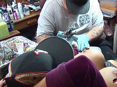 Shyla Stylez gets tattooed while toying with her tits