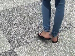 Public Wetting Jeans in Park Near the Beach