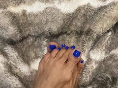 Melove Showing Her Blue Nail Polish on Her Small Feet
