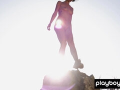 Hot muse reveals her boobs on a hilltop