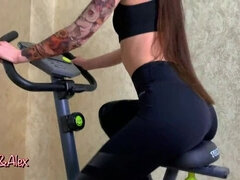 DOUBLE ORGASM ON AN EXERCISE BIKE. FUCKS A TOY AND CUMS.
