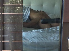 Filming a hot couple having sex while looking out the hotel window