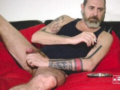 Muscular daddy hunk in a crimson apartment gets milked again