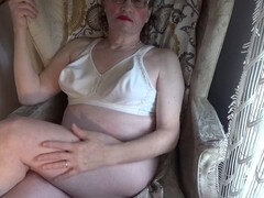 Mature crossdresser Serge Lusin shows off his big ass and small cock