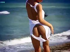 Honey Demon thinks erotic thoughts as she ambles on the beach