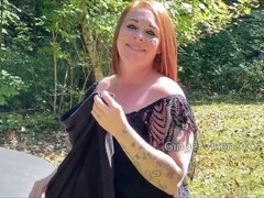 Curvy redhead MILF enjoys walking naked outside like a playful nudist