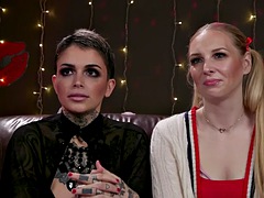 Tattooed lesbian babe pegging electrosex sub
