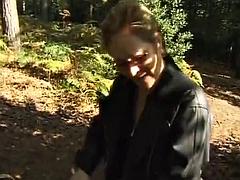A mature German domina spanks her man in the woods
