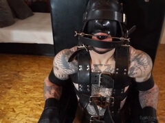 BDSM video of a tied dude that loves being all locked up